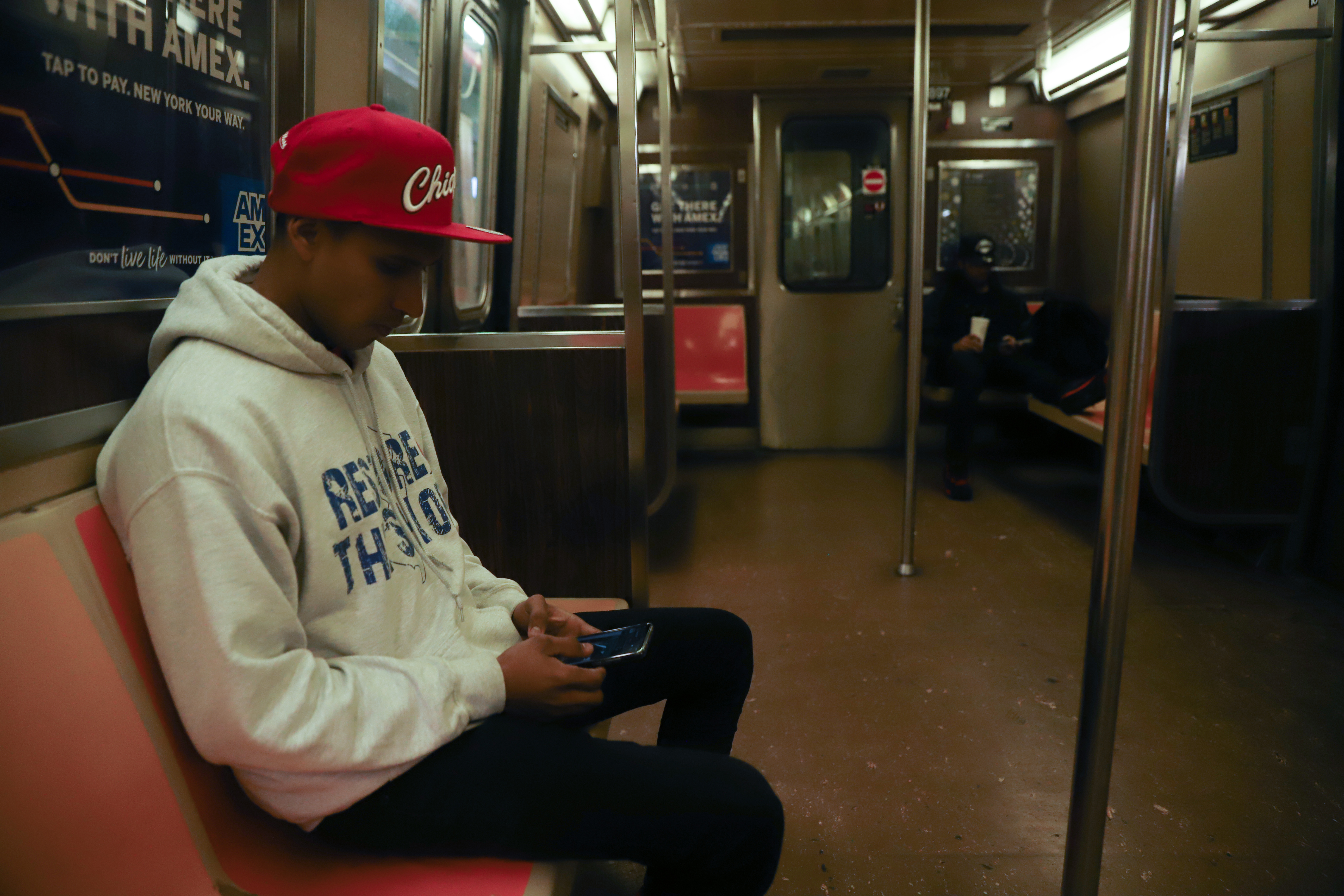 A man rides a subway train in New York City in November 2022.