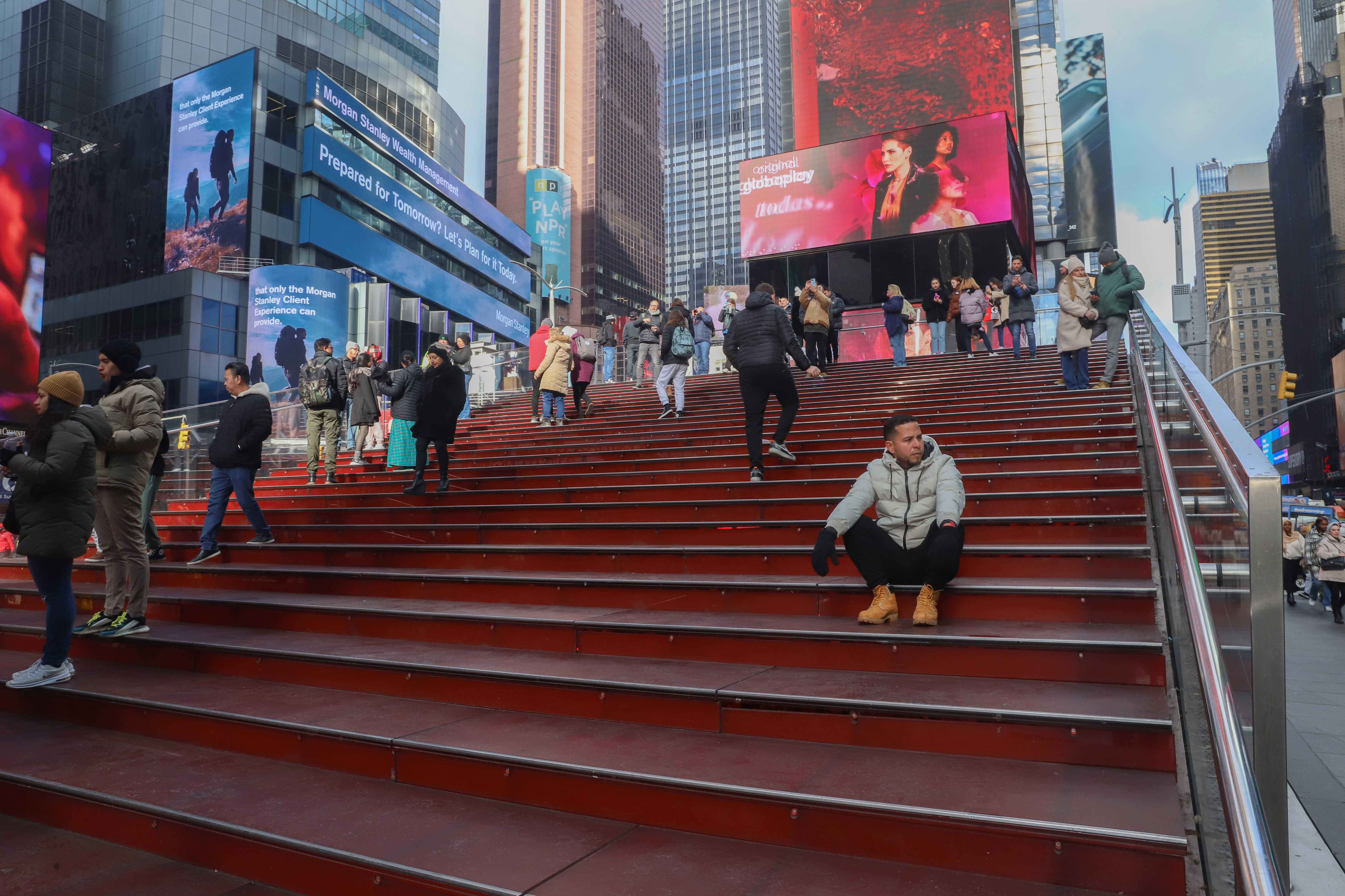 Tonny Tavera walks through Times Square.